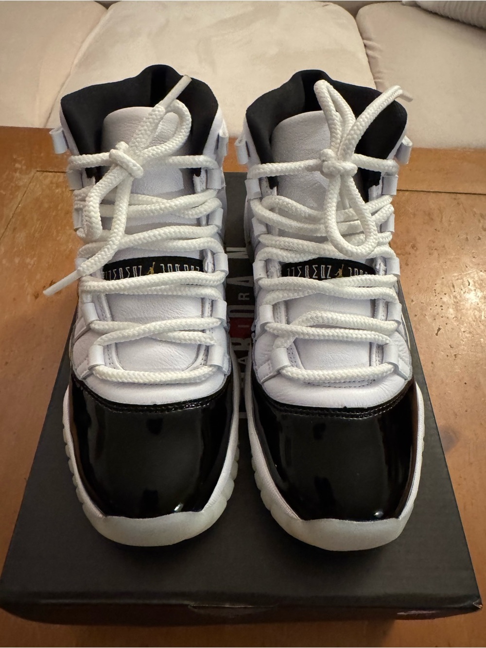 Air Jordan 11 Retro (GS) Big Kid’s Sneakers in White and Patent Black
